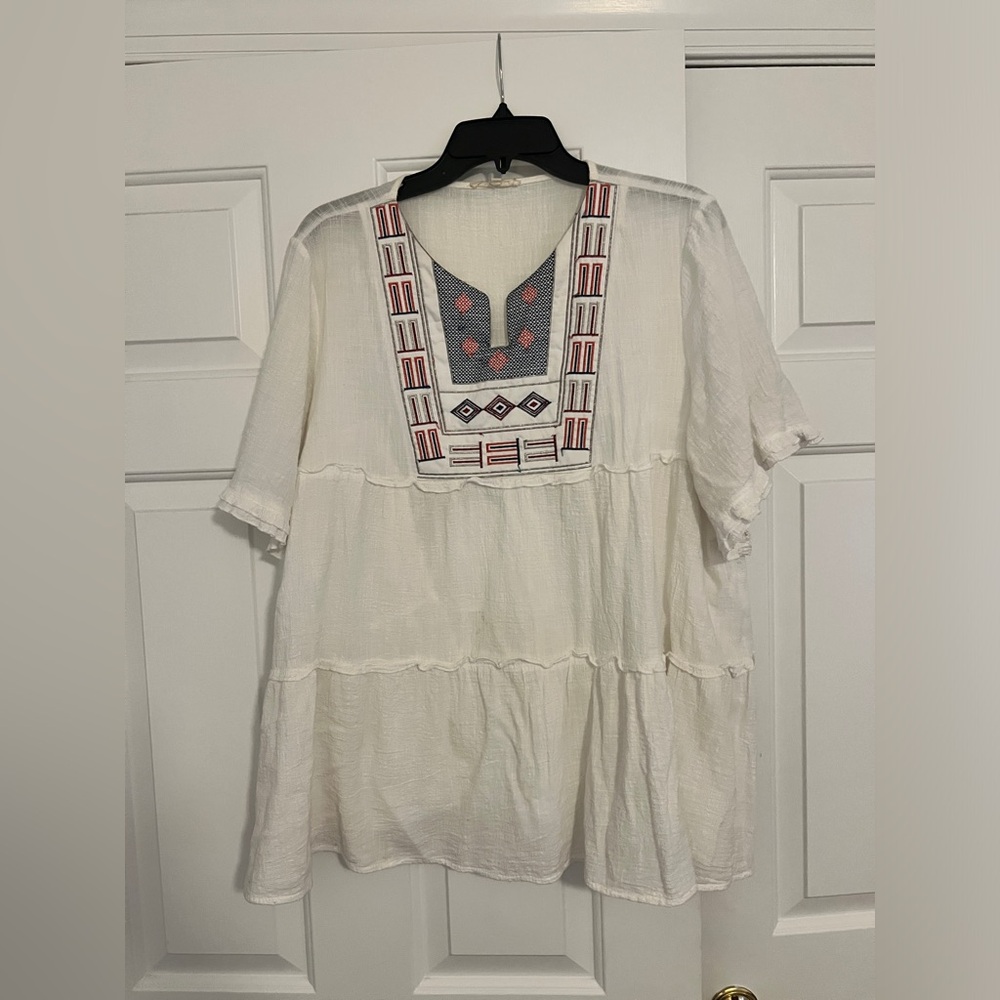White blouse with design on front